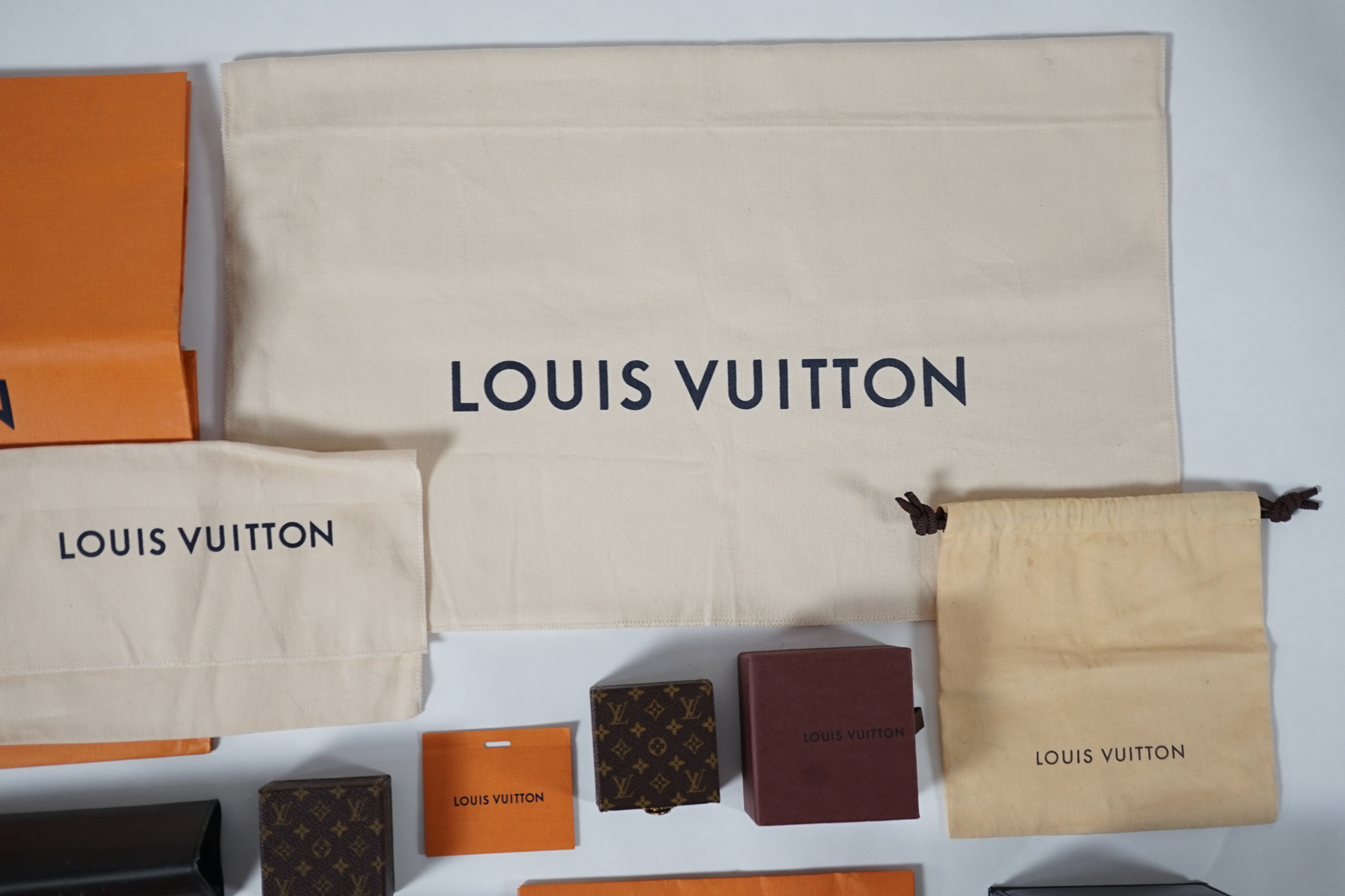 A selection of empty designer boxes including Cartier, Louis Vuitton and Chopard